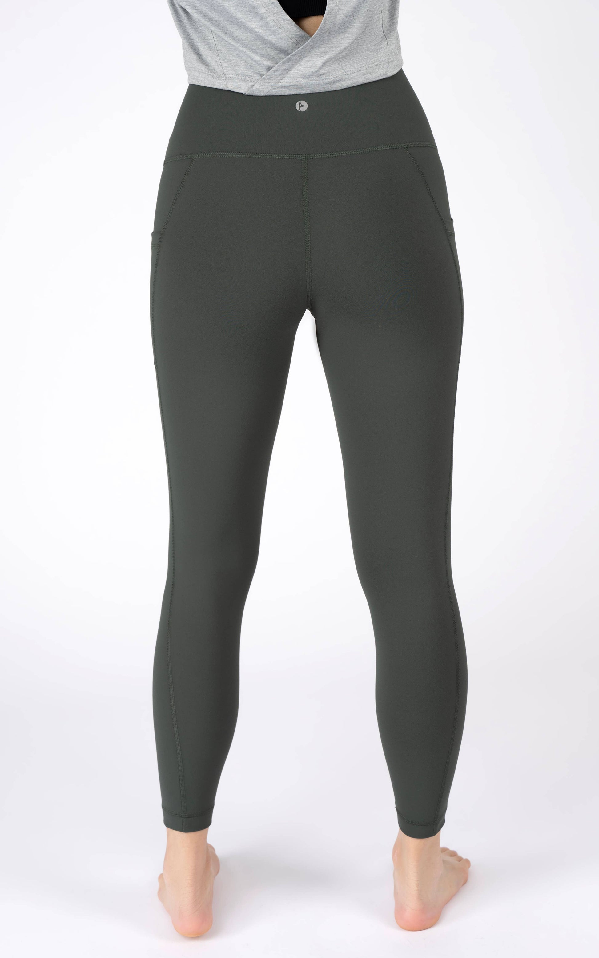 Black leggings worn by a person on a white background