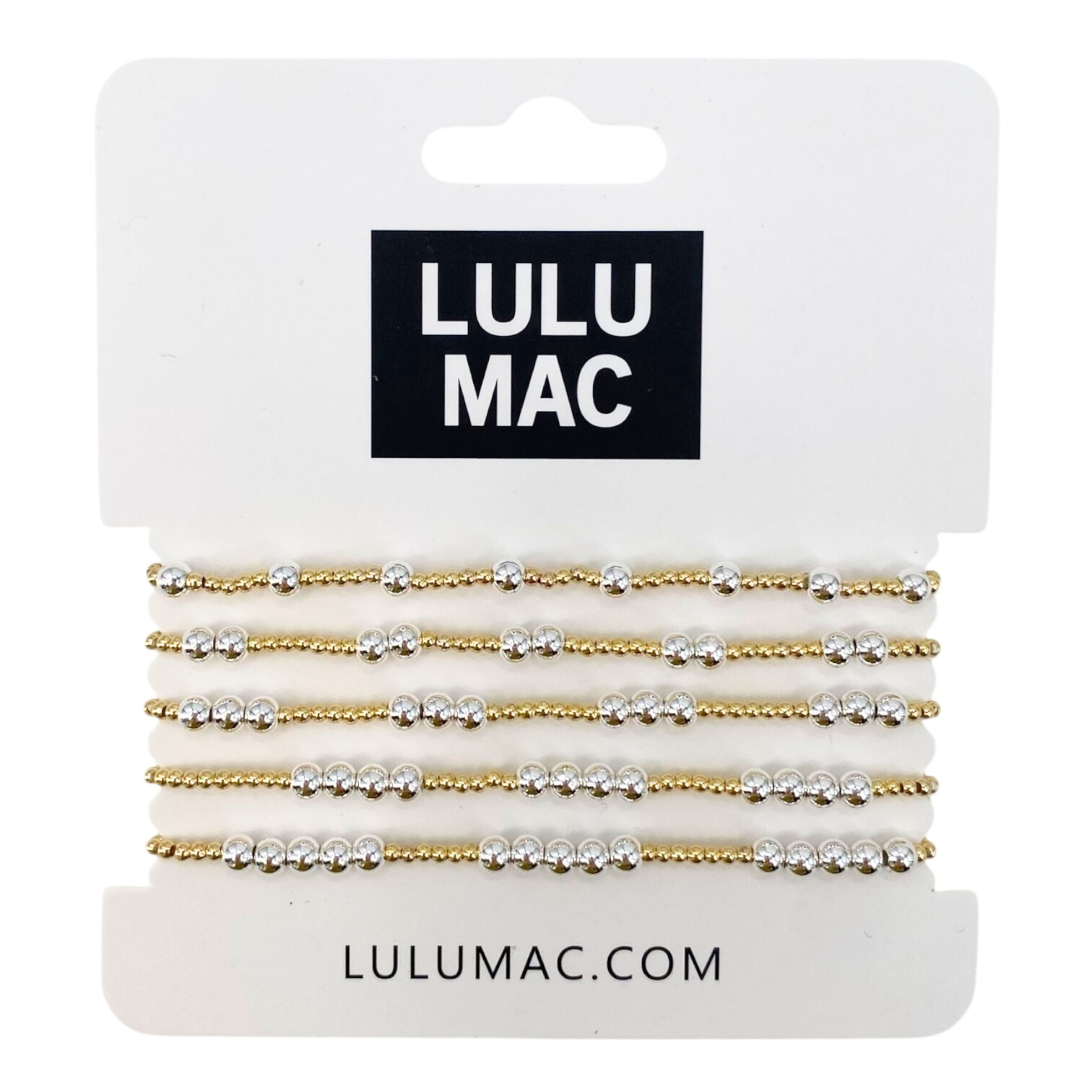 Set of gold and silver beaded bracelets on a LULU MAC branded card.