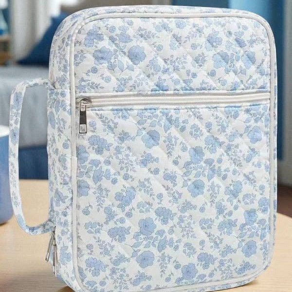 Blue floral zippered Bible cover with front pocket and adjustable strap