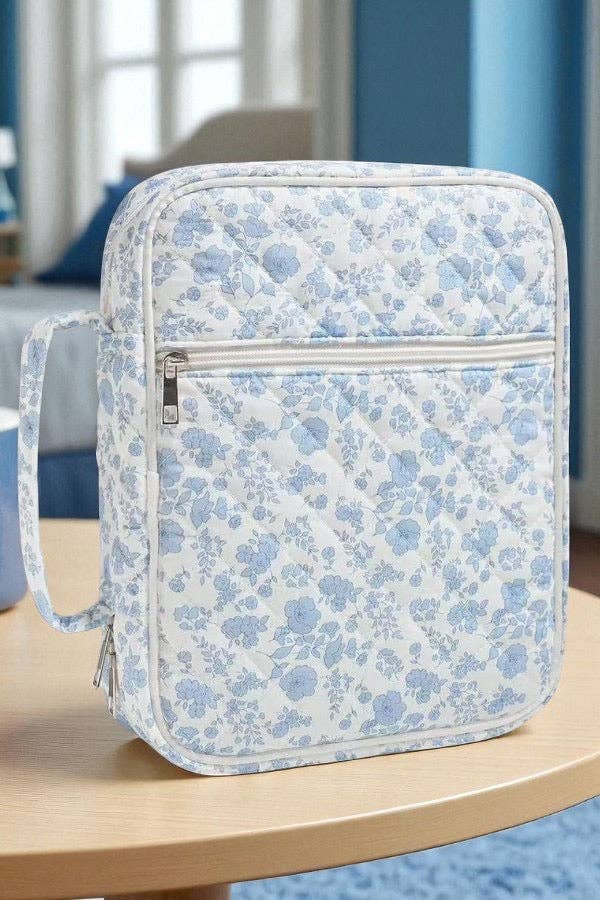 Blue floral zippered Bible cover with front pocket and adjustable strap