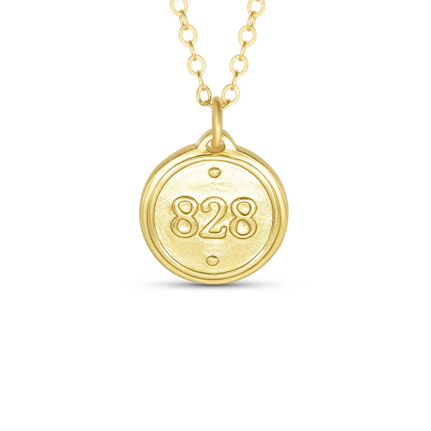 Gold necklace with a round pendant featuring the number 828 on a white background
