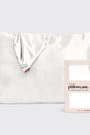 White satin pillowcase with packaging on a light gray background