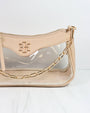 Beige handbag with gold chain detail on a white background