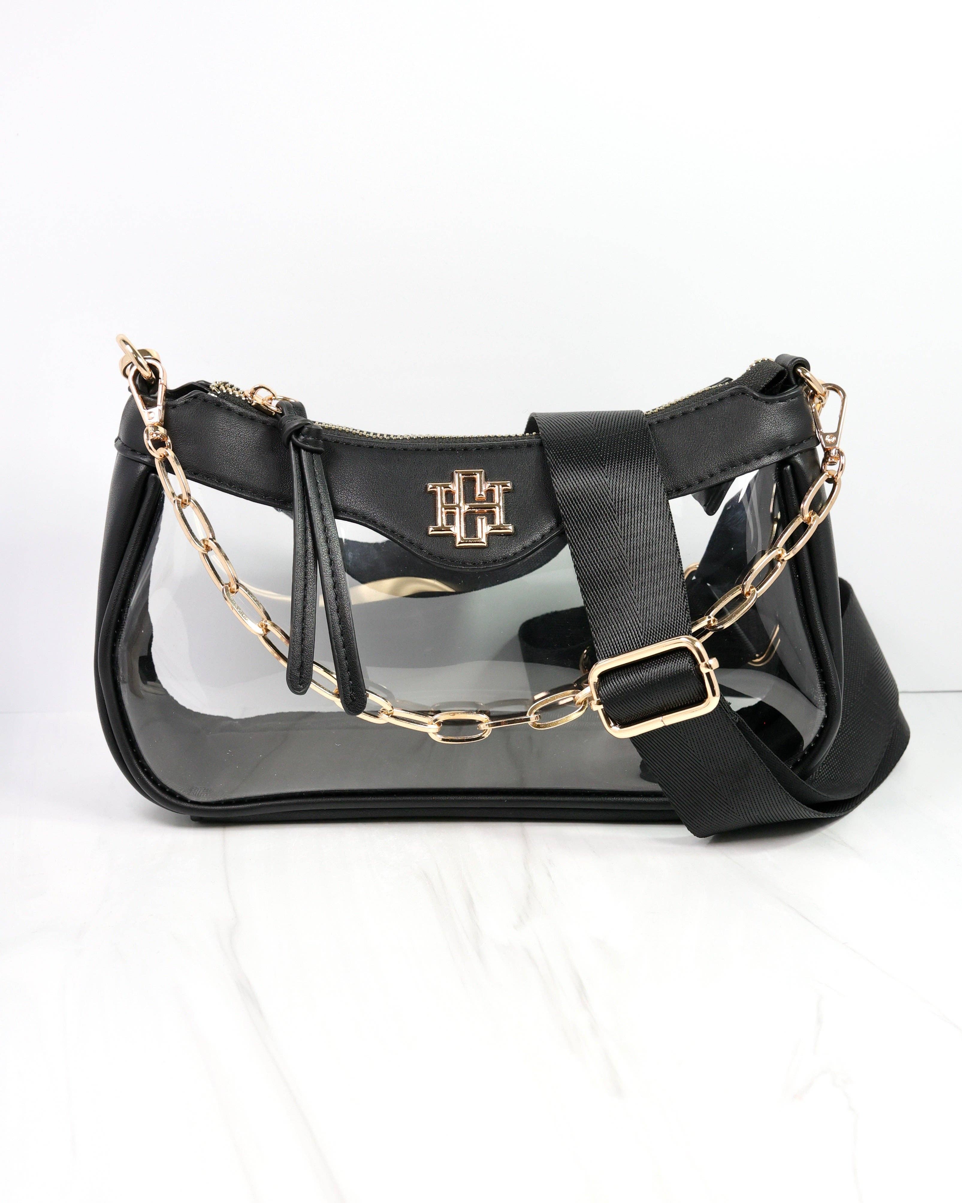 Black handbag with gold chain strap on a white background