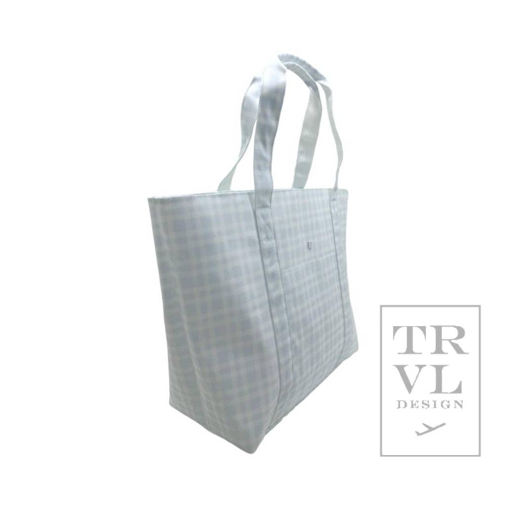 Reusable blue tote bag with a checkered pattern on a white background, featuring the TRVL Design logo.