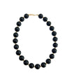 Chunky beaded necklace with dark round black beads and gold-tone clasp