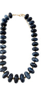 Chunky navy beaded necklace with gold clasp and oval bead links