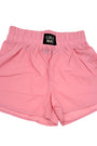Pink shorts with a visible brand label on a white background