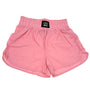 Pink shorts with a visible brand label on a white background
