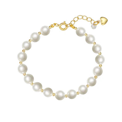 Pearl bracelet with gold clasp on a white background