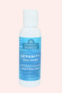 Honesty Margo Serenity Aromatherapy Hand & Body Lotion bottle on a light pink background