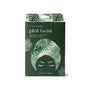 Packaging of a microfiber turban towel with tropical leaf design on a white background