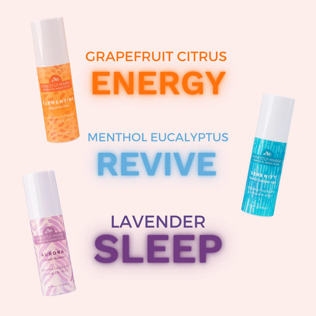 Four different bottles of a product with labels for 'Grapefruit Citrus Energy', 'Menthol Eucalyptus Revive', and 'Lavender Sleep' on a light pink background.