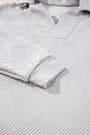Close-up of textured gray fabric with a geometric pattern