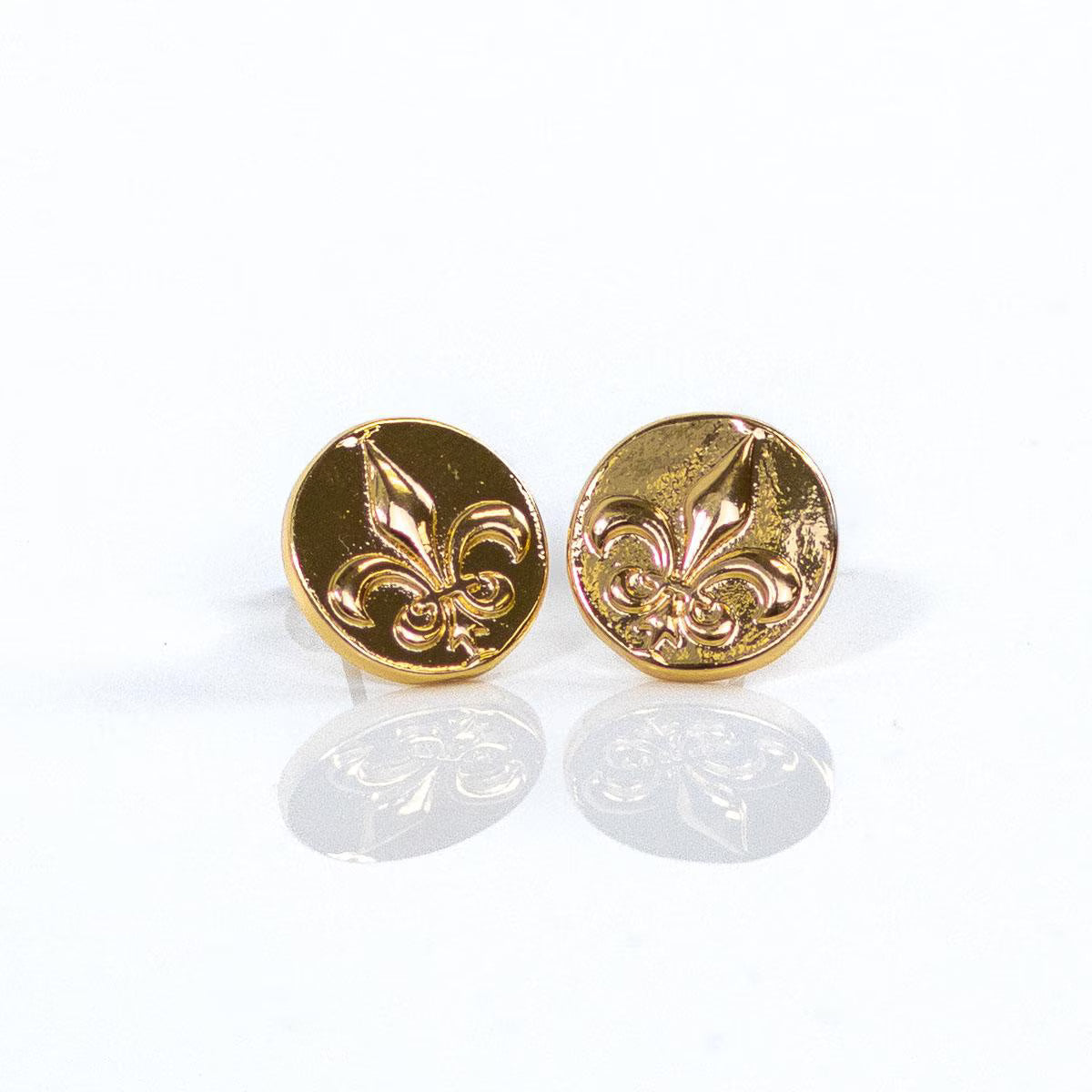 Pair of gold fleur-de-lis earrings on a white background