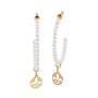 Pearl necklace with gold pendants on a white background
