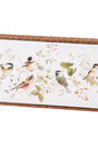 Decorative wall art with birds and floral elements in a wooden frame.