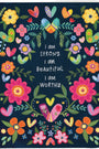 Notebook cover with colorful floral design and motivational text on a dark blue background