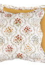 Floral-patterned pillow with a yellow accent on a white background