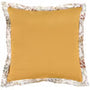 A square mustard yellow throw pillow with a white floral lace trim along the edges, shown against a plain white background.