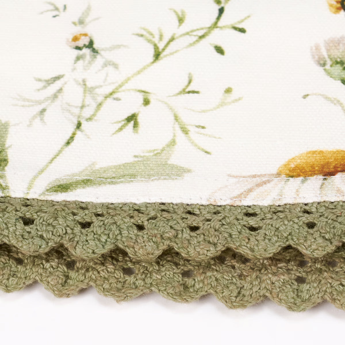 Close-up of floral fabric with a green crochet border