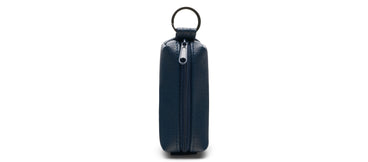 blue key ring case on a white background