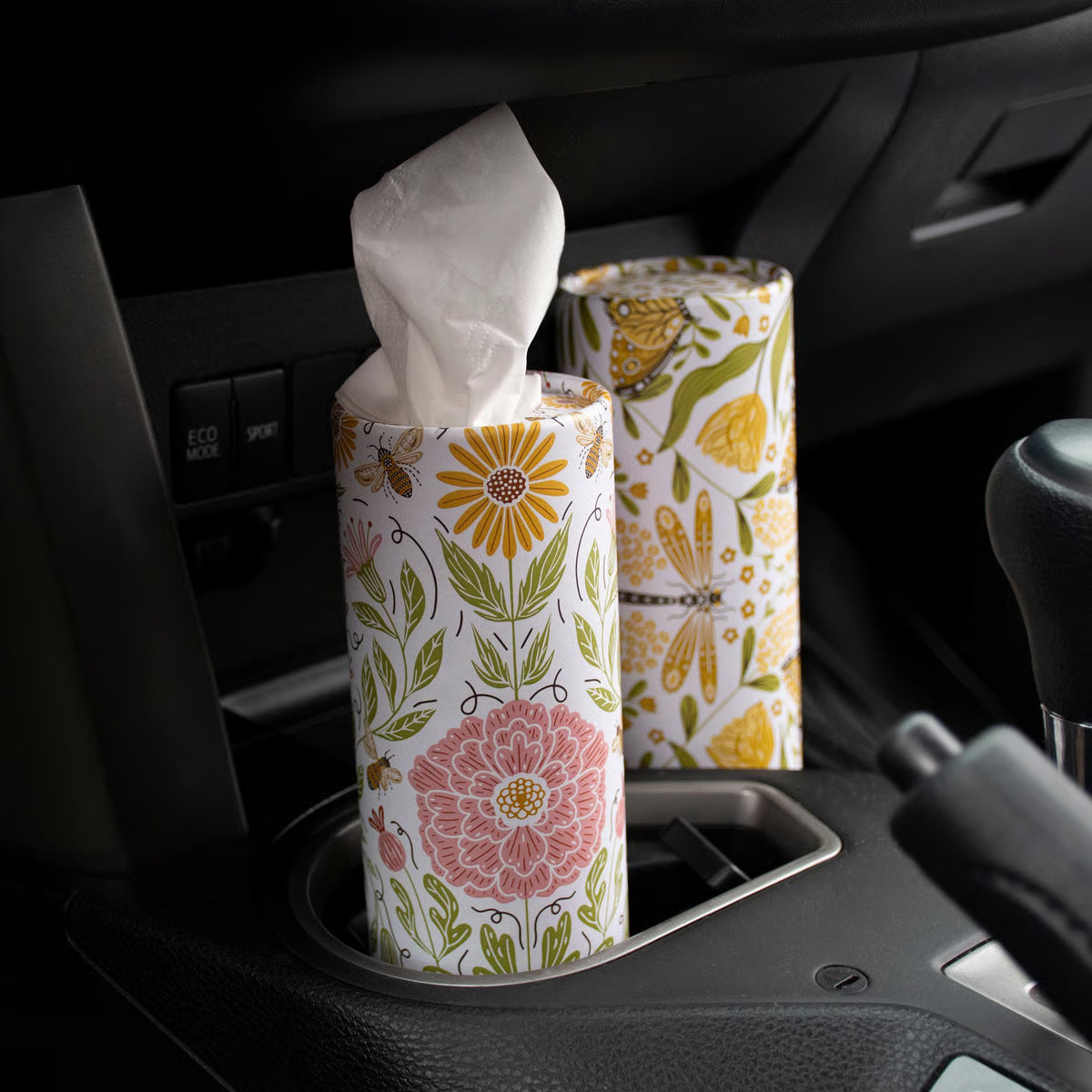 Floral-patterned tissue paper in a car cup holder