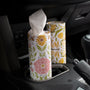 Floral-patterned tissue paper in a car cup holder