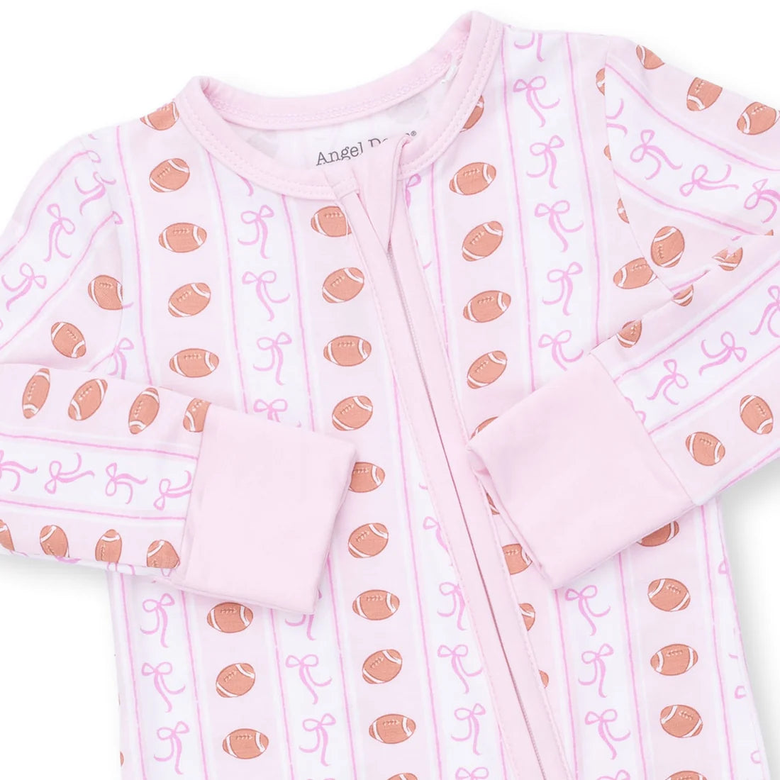 A pink long-sleeve baby sleep suit with a front zipper, featuring an all-over print of brown footballs, pink bows, and vertical pink stripes on a white background.