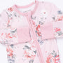 A baby long-sleeve sleep sack in light pink with a watercolor floral print in red, white, and gray, featuring a pink zipper and matching pink cuffs.