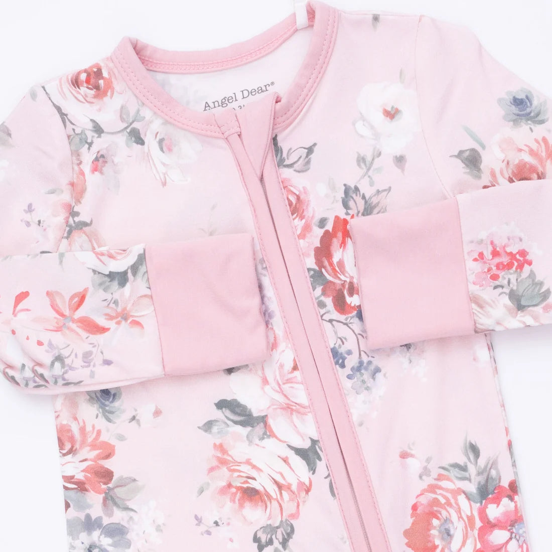 A baby long-sleeve sleep sack in light pink with a watercolor floral print in red, white, and gray, featuring a pink zipper and matching pink cuffs.