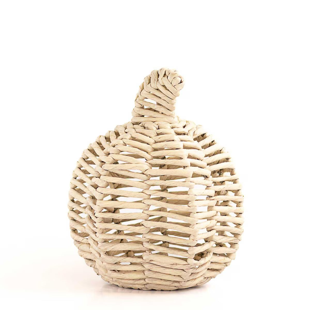 Woven basket shaped like a pumpkin on a white background