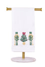 Decorative towel holder with a white towel featuring Christmas-themed designs on a white background