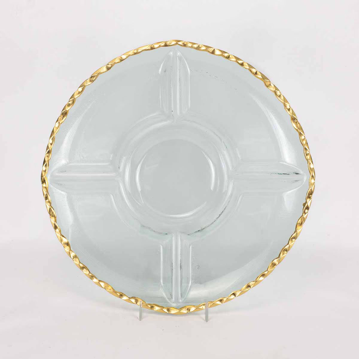 Clear glass plate with gold decorative rim on a white background
