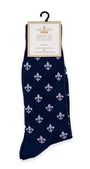 Navy blue sock with white fleur-de-lis pattern on a hanger with 'The Royal Standard' label.