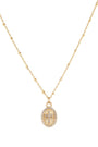 Gold necklace with a pendant on a white background