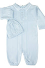 Light blue baby knitted outfit with matching hat on a white background