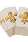Set of beige napkins with gold fleur-de-lis designs on a white background