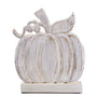 White distressed pumpkin decoration on a white background