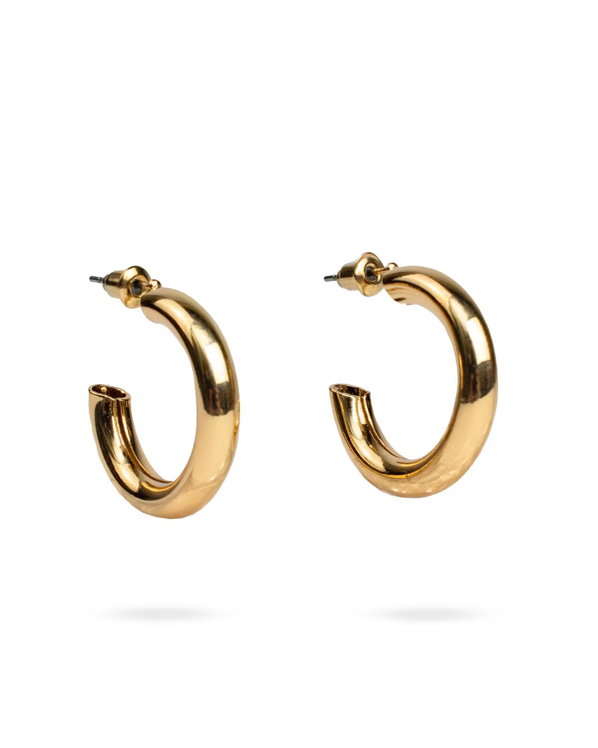 Gold hoop earrings on a white background