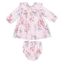 Floral baby dress and bloomers set on a white background