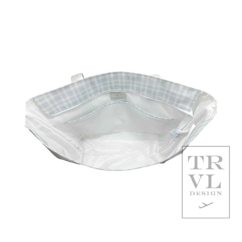 opening of a blue tote bag with a checkered pattern on a white background, featuring the TRVL Design logo.