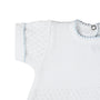 White ribbed baby sweater with blue accents on a white background