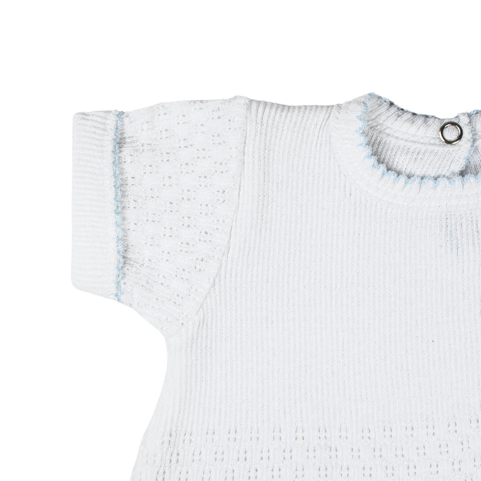 White ribbed baby sweater with blue accents on a white background