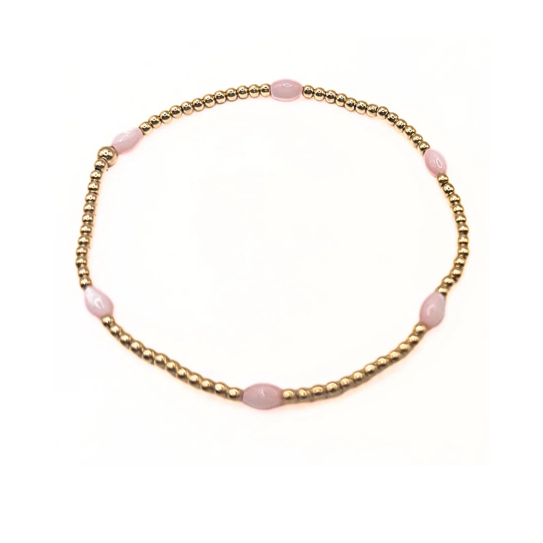 Bracelet with pink beads on a gold chain against a white background