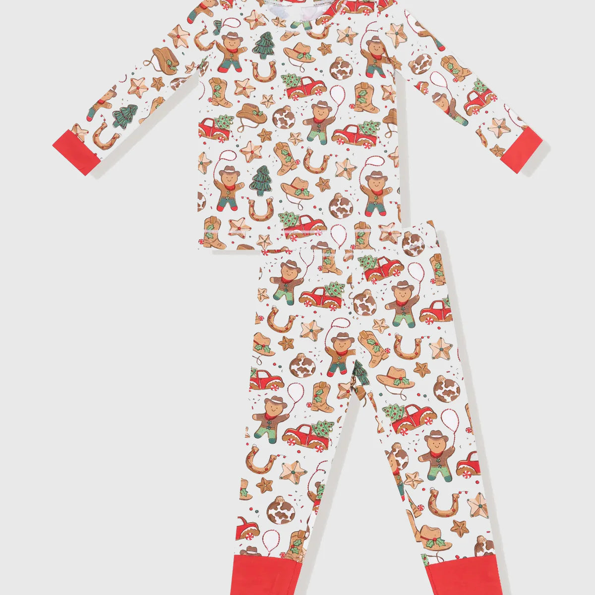 Children's pajama set with Christmas gingerbread man and reindeer pattern on a white background