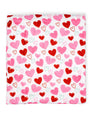 Blanket with red and pink heart pattern on a white background