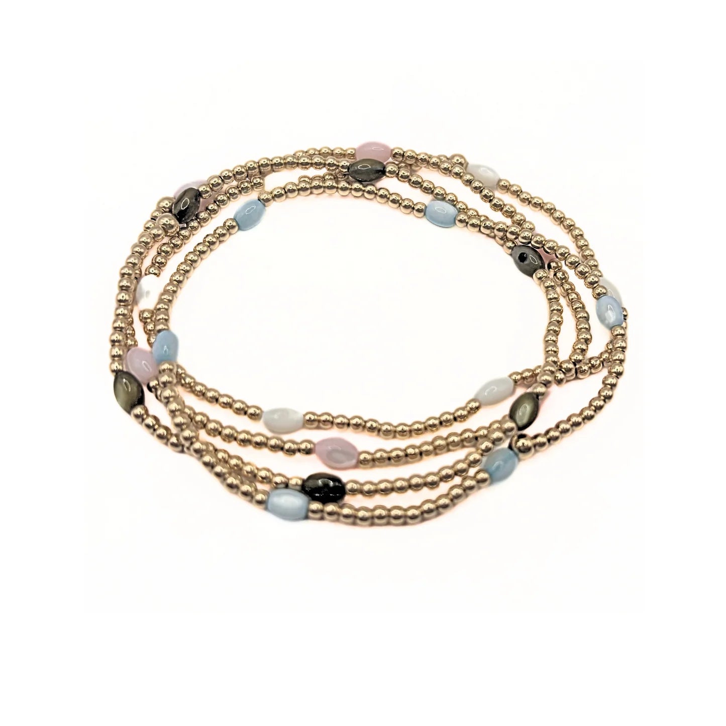 Set of three beaded bracelets with gold, black, and multicolor beads on a white background