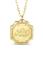 Gold necklace with a hexagonal pendant displaying the number '320' on a white background