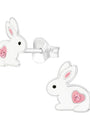 White rabbit-shaped earrings with pink hearts on a white background